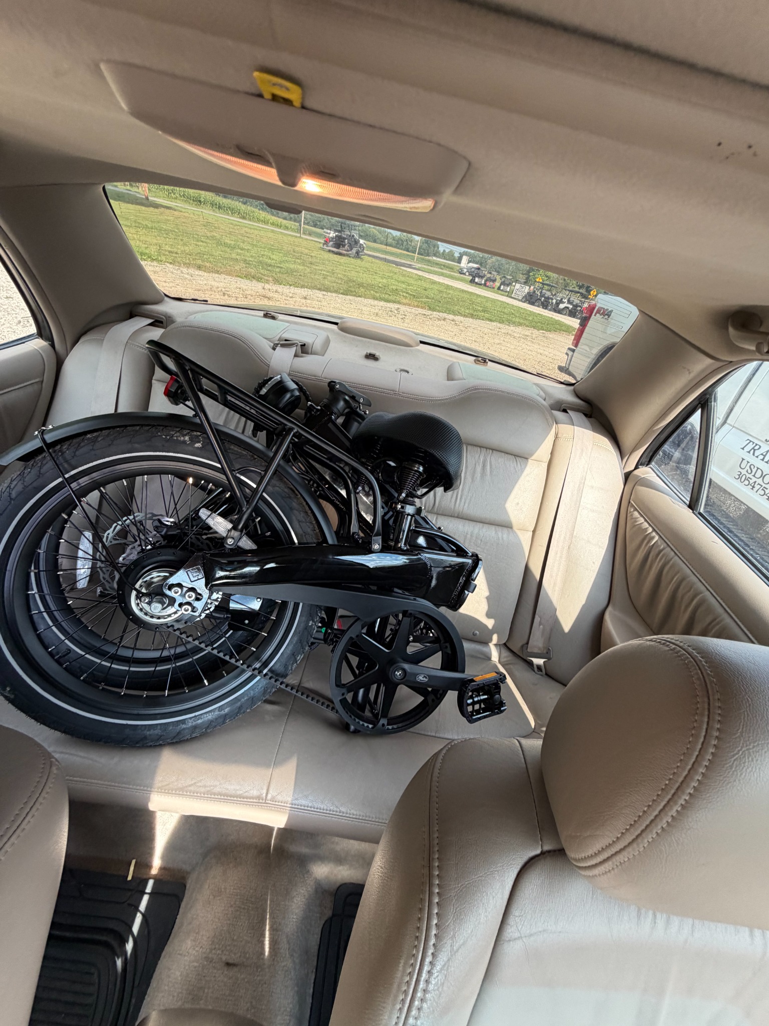Folded e-bike fitting on a car back seat